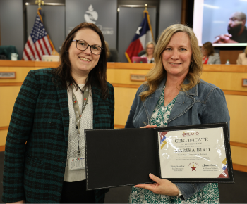  image of board vice president dr. lauren tyra with plano isd proud award recipient marika bird.